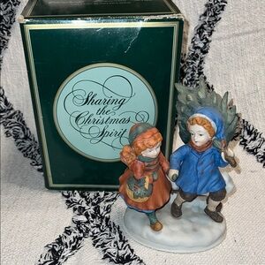1981 Avon Christmas Memories Series “Sharing The Christmas Spirit” Figurine.